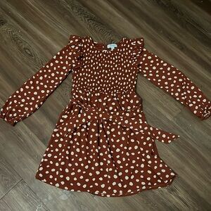 Dark orange with white dots